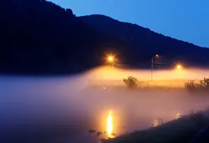 People stand on embankment of Yenisei river in Divnogorsk People stand on embankment of Yenisei river in Divnogorsk