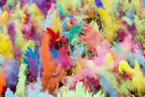 People throw coloured powder in the air during Holi festival celebrations in Berlin People throw coloured powder in the air during Holi festival celebrations in Berlin