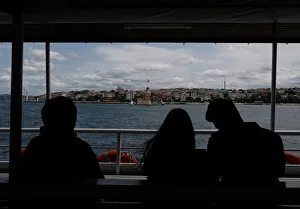 People travel on a ferry over the Bosphorus in Istanbul People travel on a ferry over the Bosphorus in Istanbul