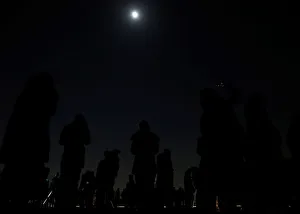 People wait to watch a lunar eclipse at the open air skydeck of Roppongi Hills Tower in People wait to watch a lunar eclipse at the open air skydeck of Roppongi Hills Tower in