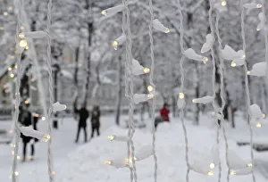 People walk in a boulevard after a heavy snowfall in Moscow People walk in a boulevard after a heavy snowfall in Moscow