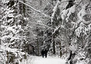 People walk in the snow at the Chalet-a-Gobet in Lausanne People walk in the snow at the Chalet-a-Gobet in Lausanne