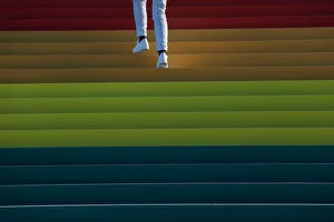A person walks up a giant LGBTQ Pride Flag installed on the steps of Franklin D A person walks up a giant LGBTQ Pride Flag installed on the steps of Franklin D
