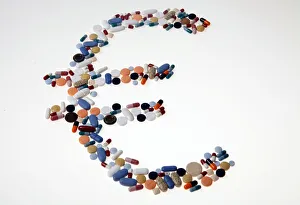 Pharmaceutical tablets and capsules are arranged on a table in this picture illustration Pharmaceutical tablets and capsules are arranged on a table in this picture illustration