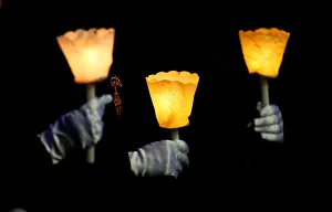 Pilgrims hold candles during the Corpus Domini procession led by Pope Francis at the Pilgrims hold candles during the Corpus Domini procession led by Pope Francis at the