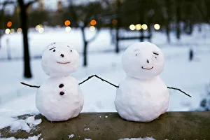 Pint-sized snowmen are seen on a railing at Central Park in New York Pint-sized snowmen are seen on a railing at Central Park in New York