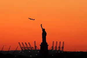 A plane is seen during take off behind the Statue of Liberty in New Yorks Harbor as seen A plane is seen during take off behind the Statue of Liberty in New Yorks Harbor as seen