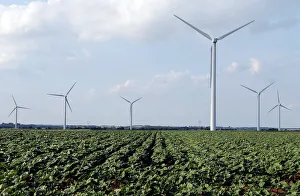 Power-generating wind turbines are seen near the city of Mouchamps Power-generating wind turbines are seen near the city of Mouchamps