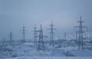Power transmission lines are seen on a frosty day outside the town of Monchegorsk in Power transmission lines are seen on a frosty day outside the town of Monchegorsk in