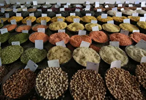 Price tags are seen on the samples of rice and lentils that are kept on display for sale Price tags are seen on the samples of rice and lentils that are kept on display for sale