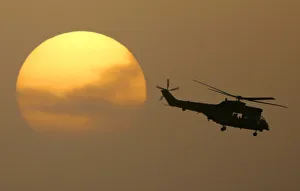 Puma helicopter flies out from the Green Zone at sunset in Baghdad Puma helicopter flies out from the Green Zone at sunset in Baghdad