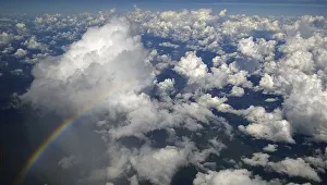 A rainbow appears as fluffy clouds are seen over the Amazon in Brazil during the 2014 A rainbow appears as fluffy clouds are seen over the Amazon in Brazil during the 2014