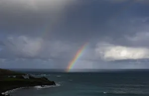 A rainbow forms as a squall moves towards Porthmeor Beach in St Ives in Cornwall A rainbow forms as a squall moves towards Porthmeor Beach in St Ives in Cornwall