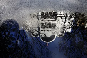 Reflection of burned trees is seen outside a church, one of three struck by suicide Reflection of burned trees is seen outside a church, one of three struck by suicide