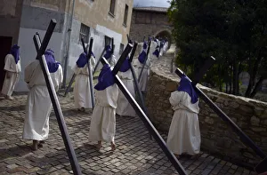 Residents dressed as penitents take part in an Easter Passion Play on Good Friday in the Residents dressed as penitents take part in an Easter Passion Play on Good Friday in the