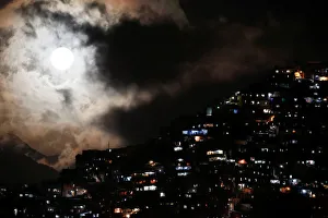 The rising supermoon is seen over the slum of Petare in Caracas The rising supermoon is seen over the slum of Petare in Caracas