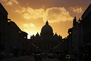 Saint Peters Basilica at the Vatican is silhouetted during sunset in Rome Saint Peters Basilica at the Vatican is silhouetted during sunset in Rome