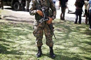Salvadorean army soldier holds his rifle during a patrol in San Salvador, El Salvador Salvadorean army soldier holds his rifle during a patrol in San Salvador, El Salvador