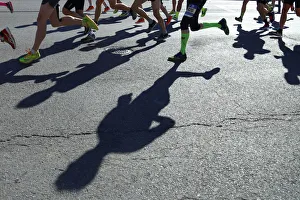 Shadows of runners hit the ground during New York City Marathon in New York Shadows of runners hit the ground during New York City Marathon in New York
