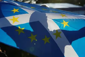 Shadow Prints: Print of a Team Europe fan displaying a flag at the Solheim Cup