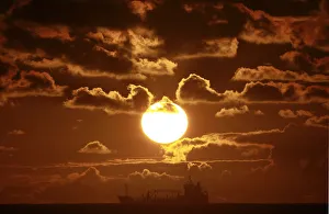 A ship crosses Coogee beach bay in Sydney at sunrise A ship crosses Coogee beach bay in Sydney at sunrise