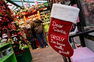 Shoppers buy Christmas stuff in the Manhattan borough of New York City, New York Shoppers buy Christmas stuff in the Manhattan borough of New York City, New York