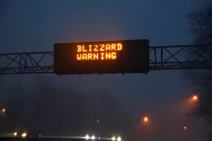A sign reading Blizzard Warning is seen above the Northern State Parkway near Westbury A sign reading Blizzard Warning is seen above the Northern State Parkway near Westbury