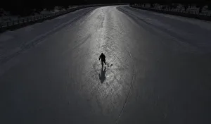 A skater casts a shadow on the Rideau Canal in Ottawa A skater casts a shadow on the Rideau Canal in Ottawa