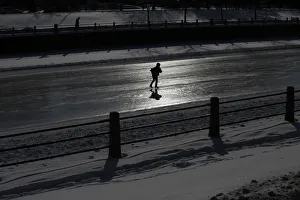 A skater is silhouetted on the Rideau Canal in Ottawa A skater is silhouetted on the Rideau Canal in Ottawa