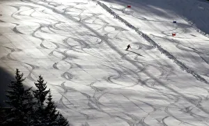 A skier enjoys his first ride down the freshly maintained slope in Fieberbrunn in austria A skier enjoys his first ride down the freshly maintained slope in Fieberbrunn in austria