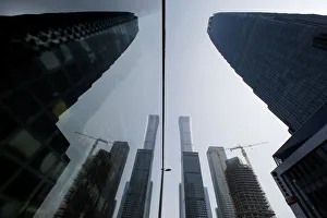 Skyscrapers in the Central Business District (Central Business District) are reflected in a window one day Skyscrapers in the Central Business District (Central Business District) are reflected in a window one day