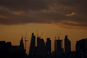 Skyscrapers stand at sunset in the city of Londons financial district in London Skyscrapers stand at sunset in the city of Londons financial district in London