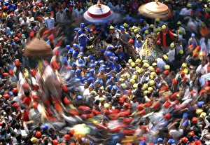 A slow motion picture of devotees carrying chariots as they participate in the Chariot A slow motion picture of devotees carrying chariots as they participate in the Chariot