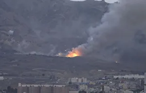 Smoke billows from an army weapons depot after it was hit by an air strike in Yemen's Smoke billows from an army weapons depot after it was hit by an air strike in Yemen's