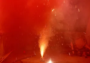 Smoke billows from a firework after it was lit on the rooftop of a residential building Smoke billows from a firework after it was lit on the rooftop of a residential building