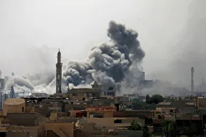 Smoke rises from an airstrike during a battle between Iraqi forces Smoke rises from an airstrike during a battle between Iraqi forces