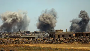 Smoke rises from al-Harak town, as seen from Deraa countryside Smoke rises from al-Harak town, as seen from Deraa countryside