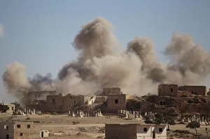 Smoke rises behind the ancient castle of the rebel-controlled town of Maaret al-Numan Smoke rises behind the ancient castle of the rebel-controlled town of Maaret al-Numan
