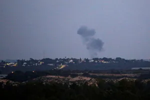 Smoke rises following an Israeli air strike on the Gaza Strip as seen from the Israeli Smoke rises following an Israeli air strike on the Gaza Strip as seen from the Israeli