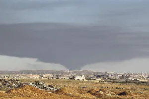 Smoke rises over the industrial city in Aleppo, Syria Smoke rises over the industrial city in Aleppo, Syria