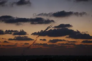 A smoke trail is seen as a rocket is launched from the northern Gaza Strip towards Israel A smoke trail is seen as a rocket is launched from the northern Gaza Strip towards Israel