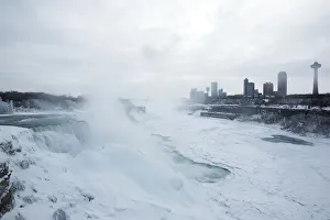 A snow-covered landscape is seen over the frozen Niagara Falls in Niagara Falls, New York A snow-covered landscape is seen over the frozen Niagara Falls in Niagara Falls, New York