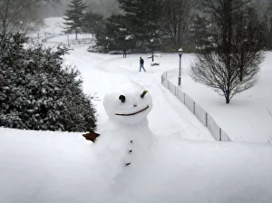 A snowman sits on a bridge in Central Park as snow falls in New York A snowman sits on a bridge in Central Park as snow falls in New York