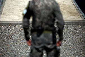 A South Korean soldier stands guard near the concrete borderline at the truce village of A South Korean soldier stands guard near the concrete borderline at the truce village of