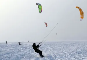 Prints of Kite surfers take advantage of the frozen Puck Bay in Chalupy, Hel Peninsula February 4, 2012 Ukraine Prints: Print of Kite surfers on frozen Puck Bay