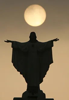 The statue of Jesus Christ at the Resurrection of our Lord parish church is silhouetted The statue of Jesus Christ at the Resurrection of our Lord parish church is silhouetted
