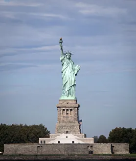 The Statue of Liberty is pictured with no people surrounding her base in New York The Statue of Liberty is pictured with no people surrounding her base in New York