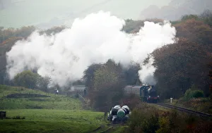 A steam train travels along the East Lancashire Railways line near Irwell Vale station A steam train travels along the East Lancashire Railways line near Irwell Vale station