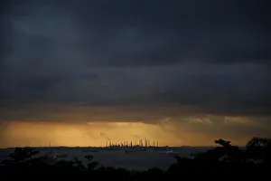 Storm clouds gather over Shells Pulau Bukom oil refinery in Singapore Storm clouds gather over Shells Pulau Bukom oil refinery in Singapore