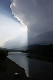 Storm clouds are seen over the Mana river in Taiga district near the village of Ust-Mana Storm clouds are seen over the Mana river in Taiga district near the village of Ust-Mana